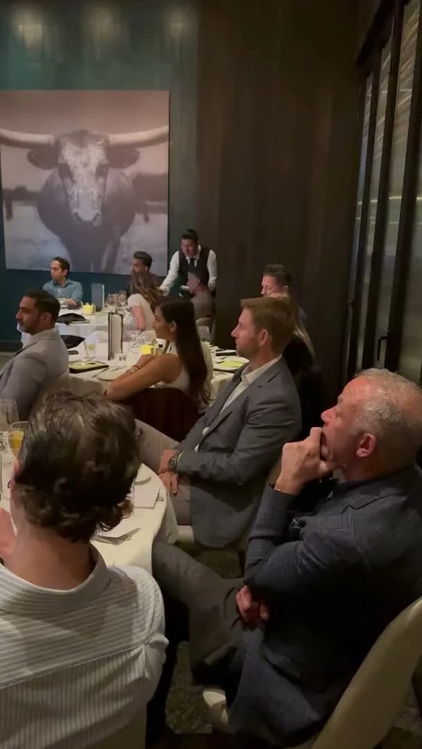 Guests listening from the tables along the wall