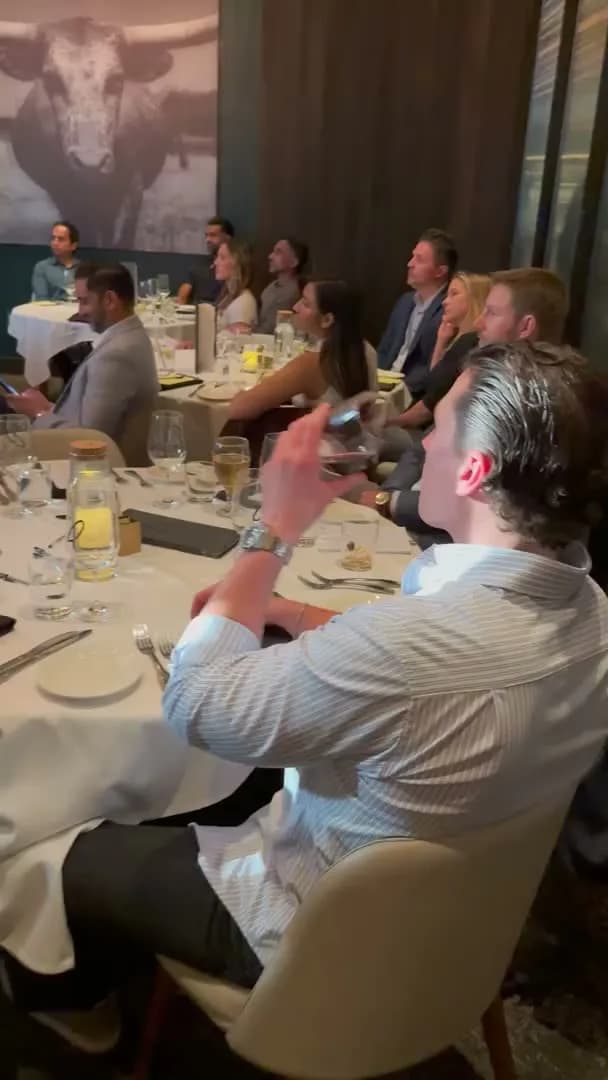 A guest applauding from the front table
