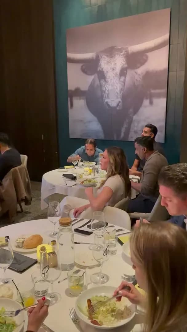 Dinner served across the room while the conversation continues